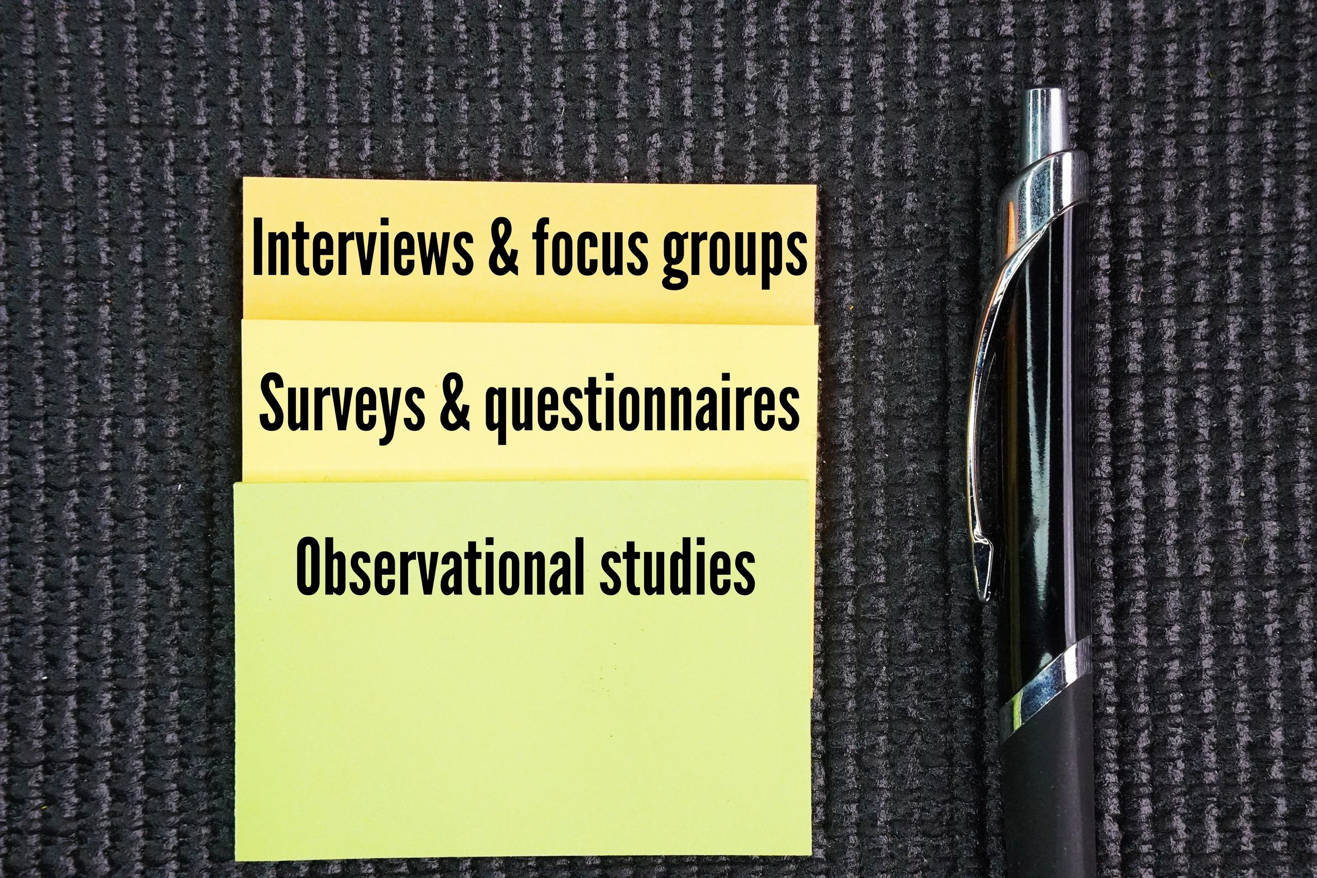 Team reviewing assessment documentation and research materials